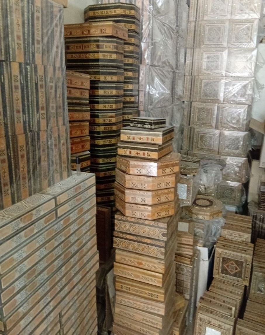 Finished Damascene boxes and inventory at a partner workshop
